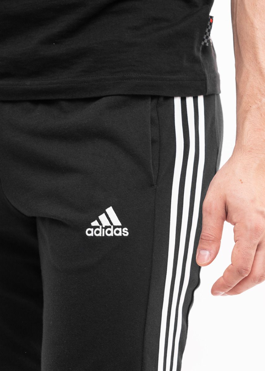 adidas Pánské tepláky Essentials Single Jersey Tapered Open Hem 3-Stripes IC0044