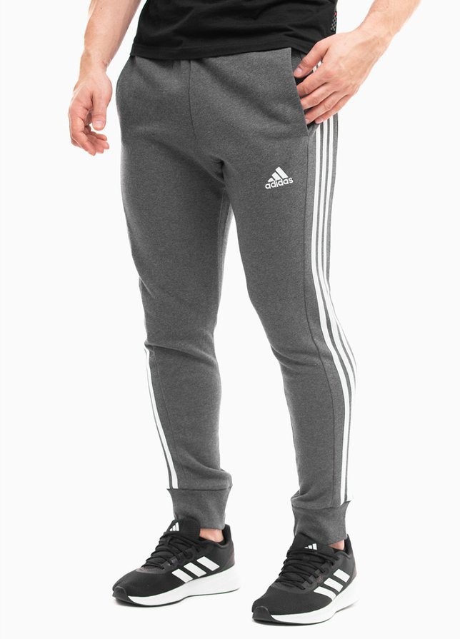 adidas Pánské tepláky Essentials French Terry Tapered Cuff 3-Stripes IC9408 adidas Pánské tepláky Essentials French Terry Tapered Cuff 3-Stripes IC9408